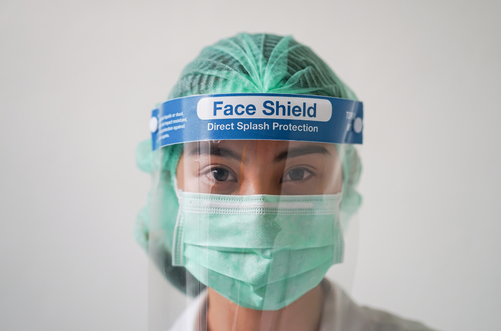 a medical professional wearing a face shield