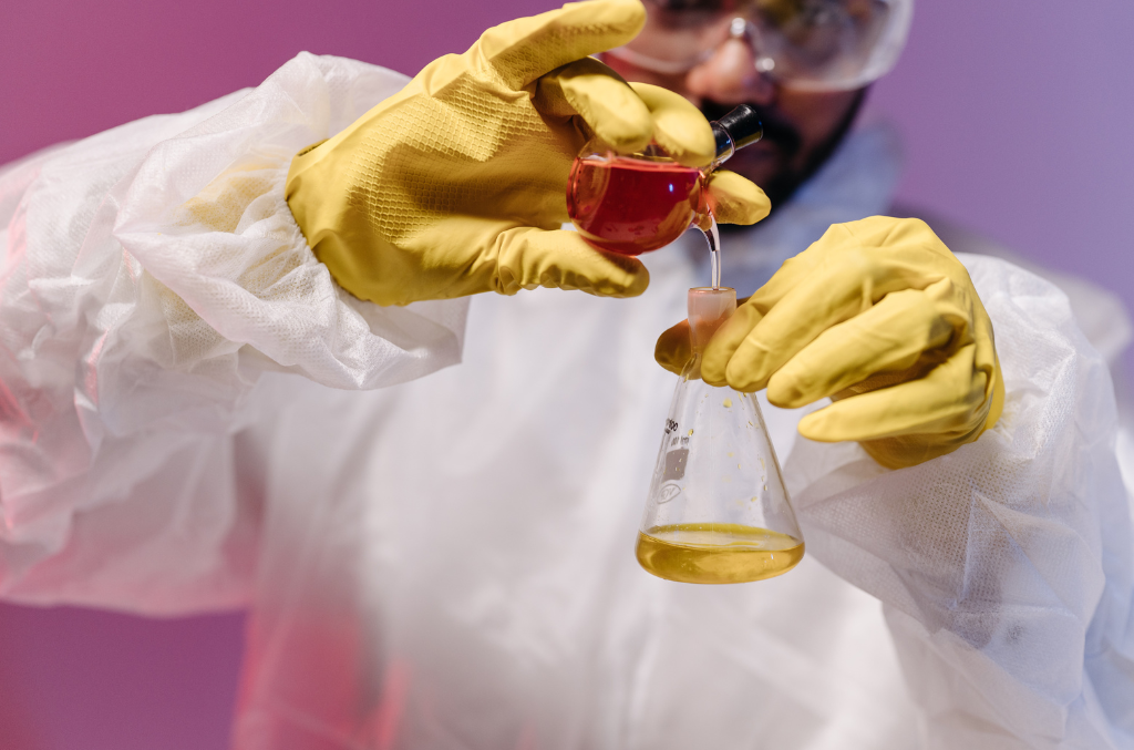 a scientist wearing yellow Chemical Resistant Gloves