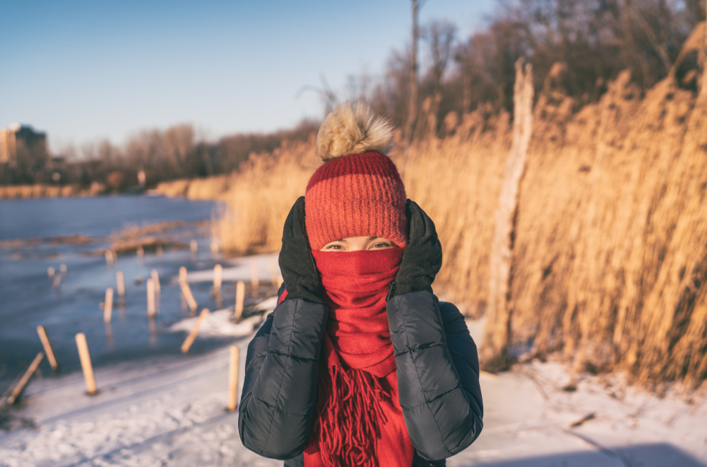 a woman wearing cold protection gloves