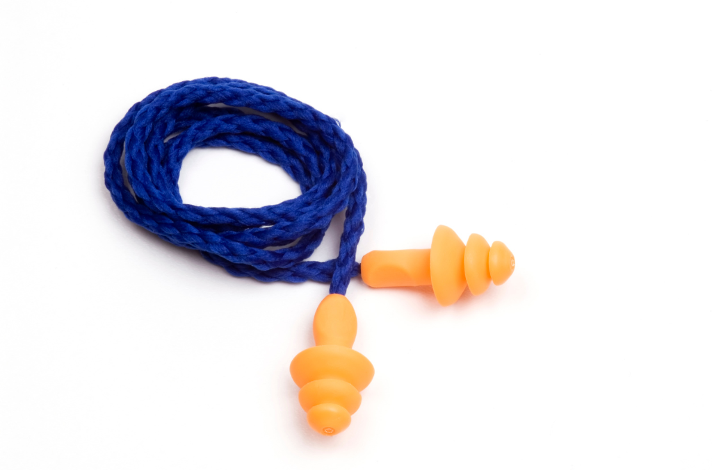 blue and yellow earplugs on a white background